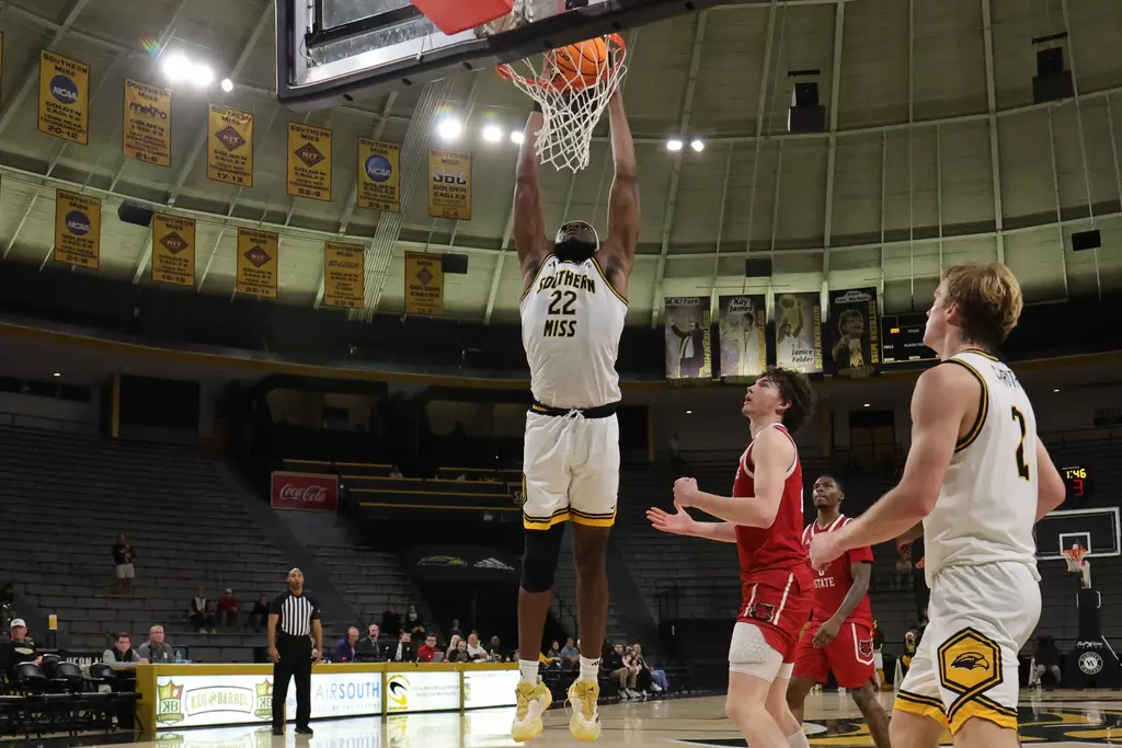 Southern Mississippi Golden Eagles center Tegra Izay (22) attempts a dunk in a game between Southern Miss Golden Eagles and Arkansas State in a NCAA Men's Basketball game. December 20, 2025 (Joe Harper/bgnphoto.com)