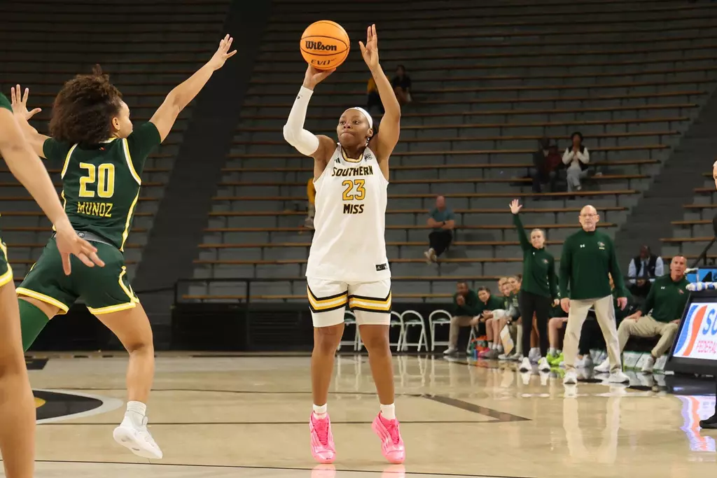 Southern Miss Lady Eagles guard Hayleigh Breland (23) takes a three point shot in a game between Southern Miss Golden Eagles and UAB Blazers and in the NCAA Women's Basketball game. December 07, 2025 (Joe Harper/bgnphoto.com)