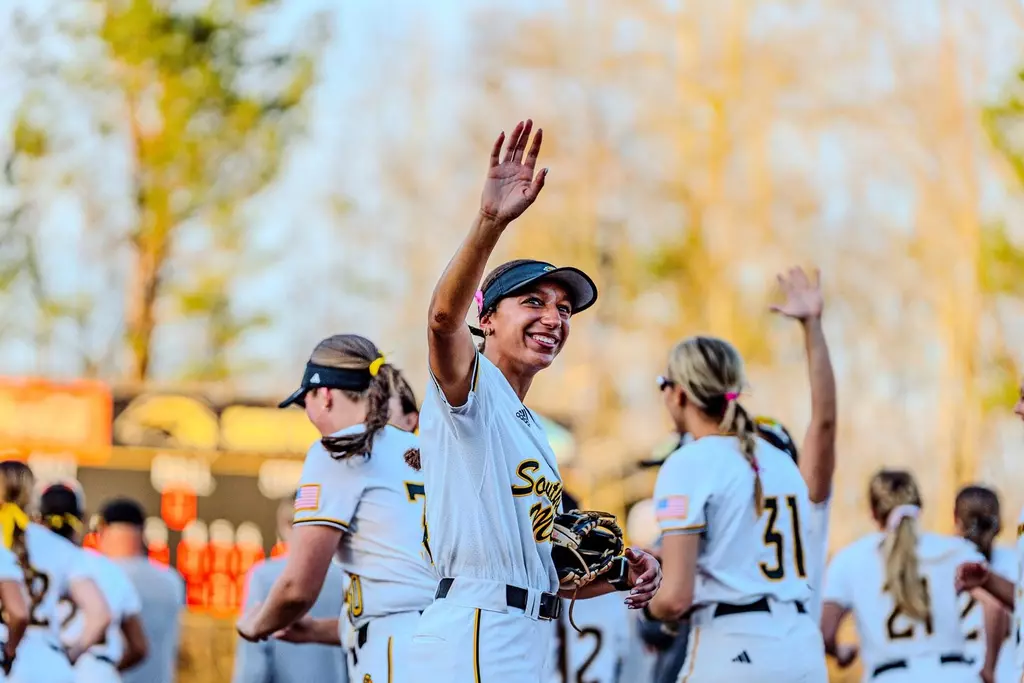 Madison Johnson waving to fans