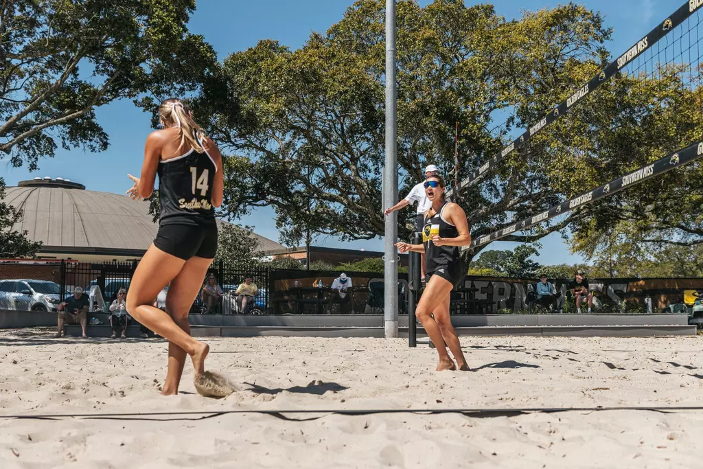 Abby Lewis (14), left, and Zuzanna Michalska (1), right, celebrate at the Spring Break Slam