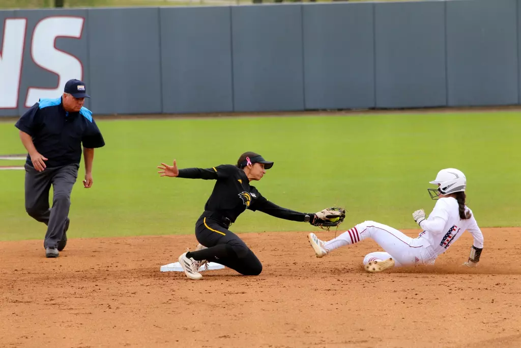 Madison Johnson tagging a runner out