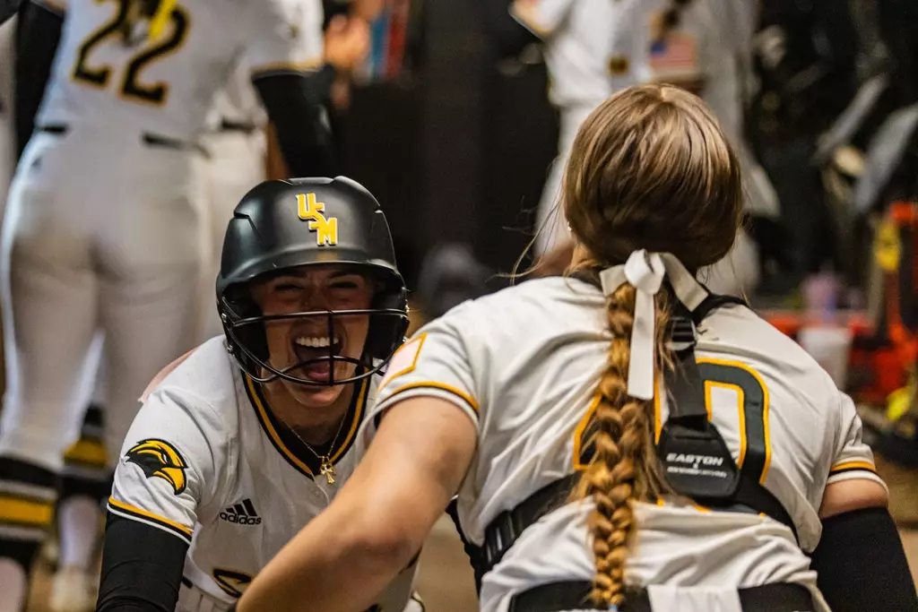 Abbi Troquille celebrating in dugout