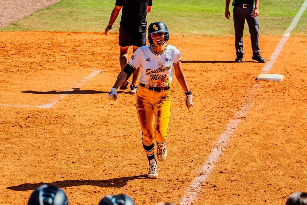 Hannah Christian (31) rounds third towards home after hitting Southern Miss' first home run of the season against Brown