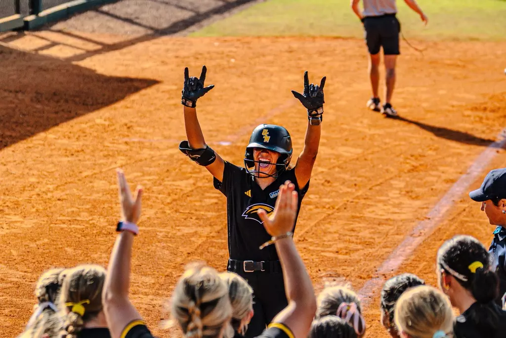 Madison Johnson (4) celebrates a home run against Presbyterian