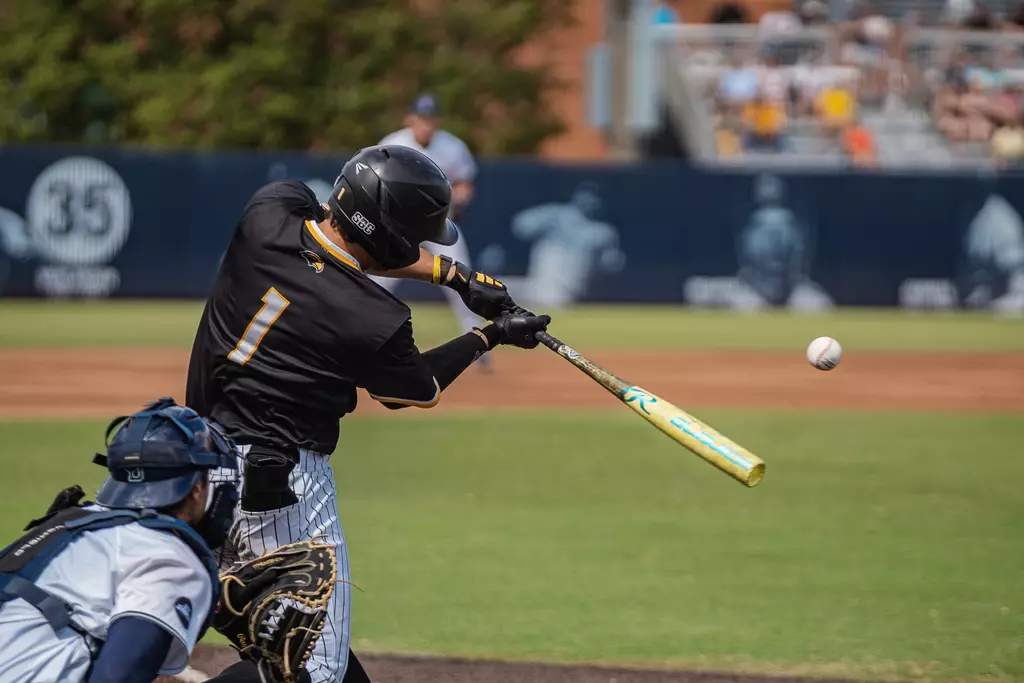 Joey Urban makes contact with one before his Homerun