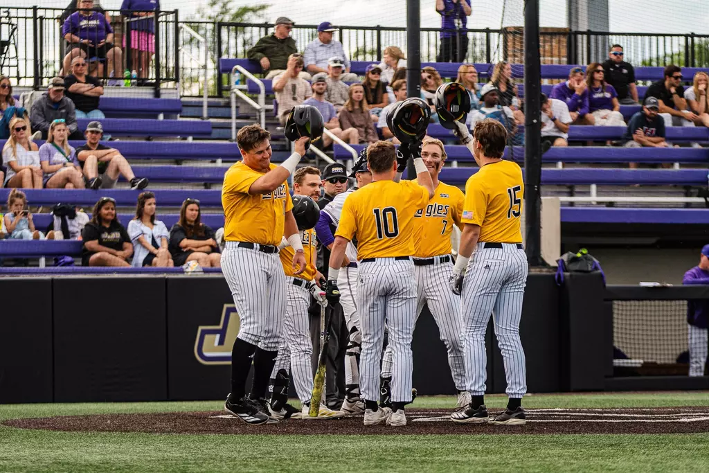 Ben Higdon celebrates at the plate after his homerun