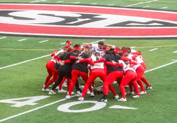 Team huddle vs. MSU Moorhead 4-18-25