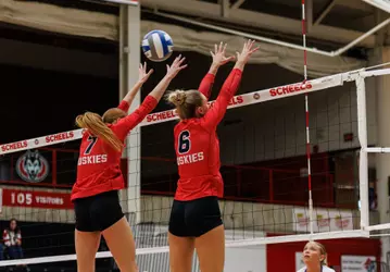 Kinsey Mohwinkle (L) and Carlie Willis (R) go up for a block vs. Minnesota State 9-24-26