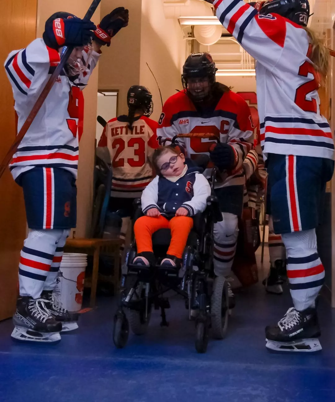 Emmy Entering the Ice with Team