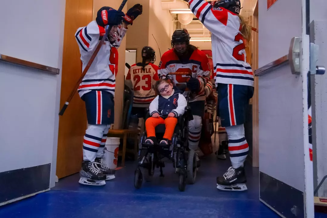 Emmy Entering the Ice with Team
