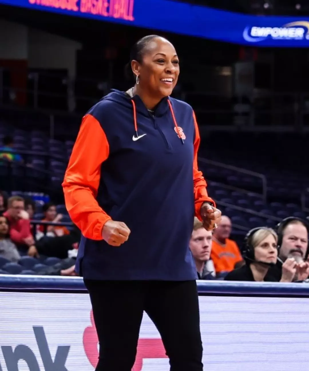 Felisha Legette-Jack smiles on the sidelines