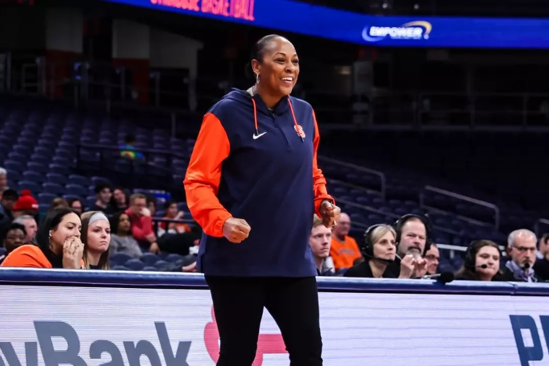 Felisha Legette-Jack smiles on the sidelines