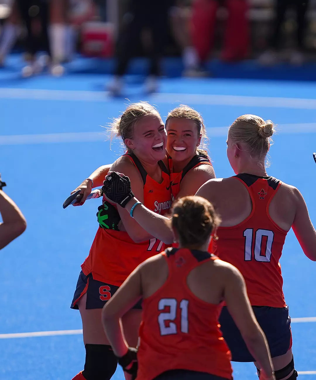 Syracuse field hockey celebrates a goal against Louisville