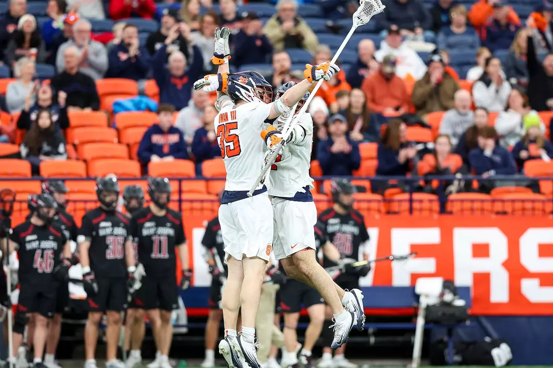 Syracuse celebrates a goal against Saint Joseph's