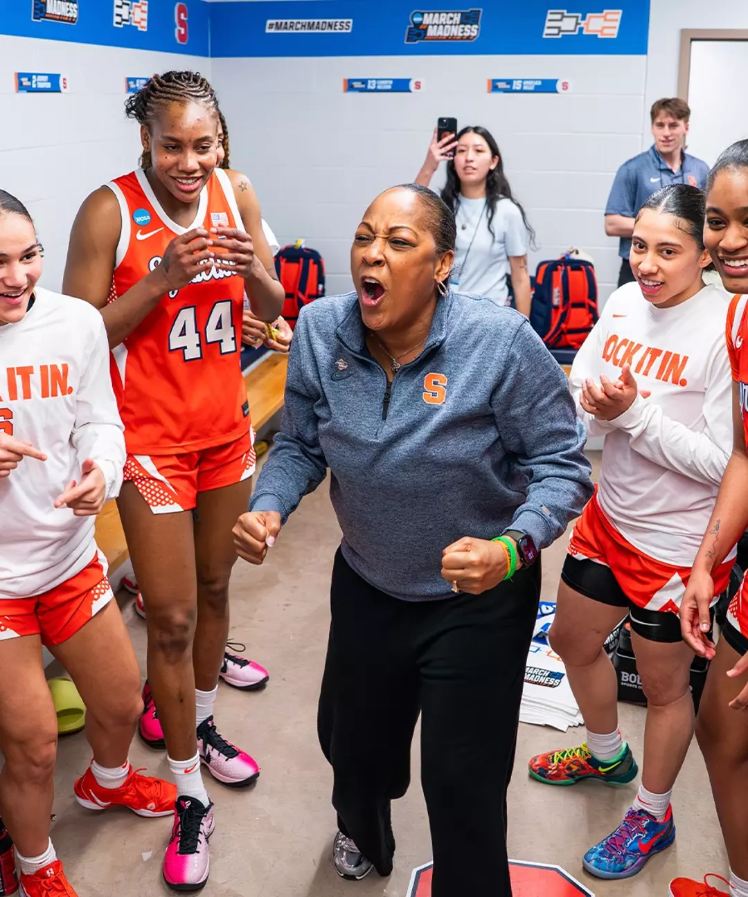 Syracuse head coach Felisha Legette-Jack celebrates in the locker room with her team