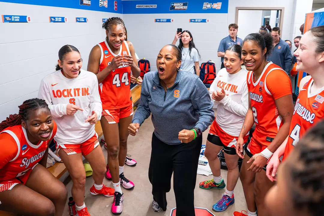 Syracuse head coach Felisha Legette-Jack celebrates in the locker room with her team