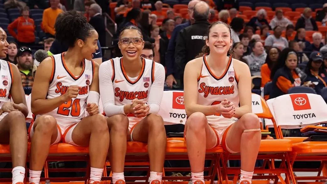 Laila and Sophie smiling on bench
