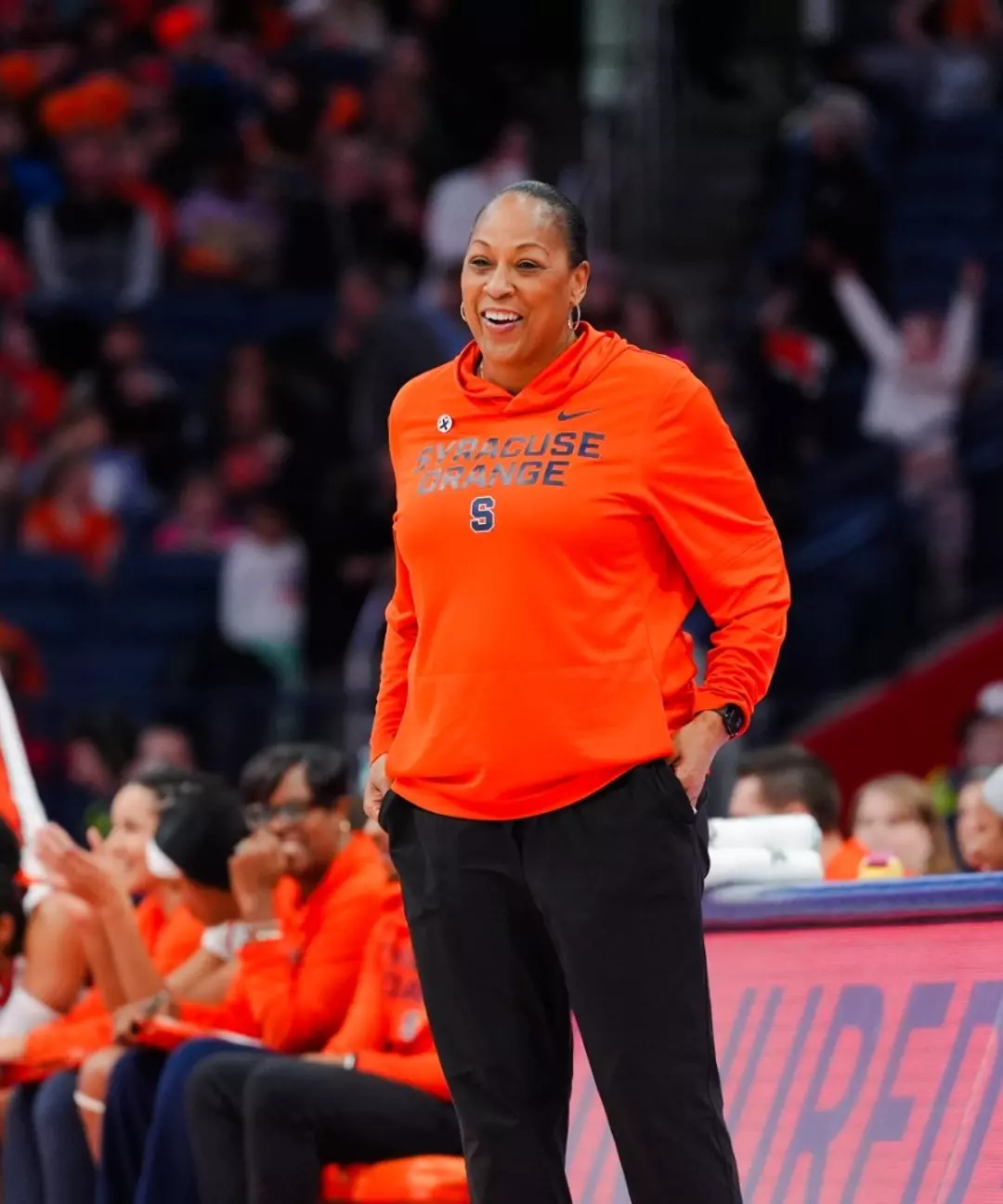 Felisha Legette-Jack smiling on the sidelines