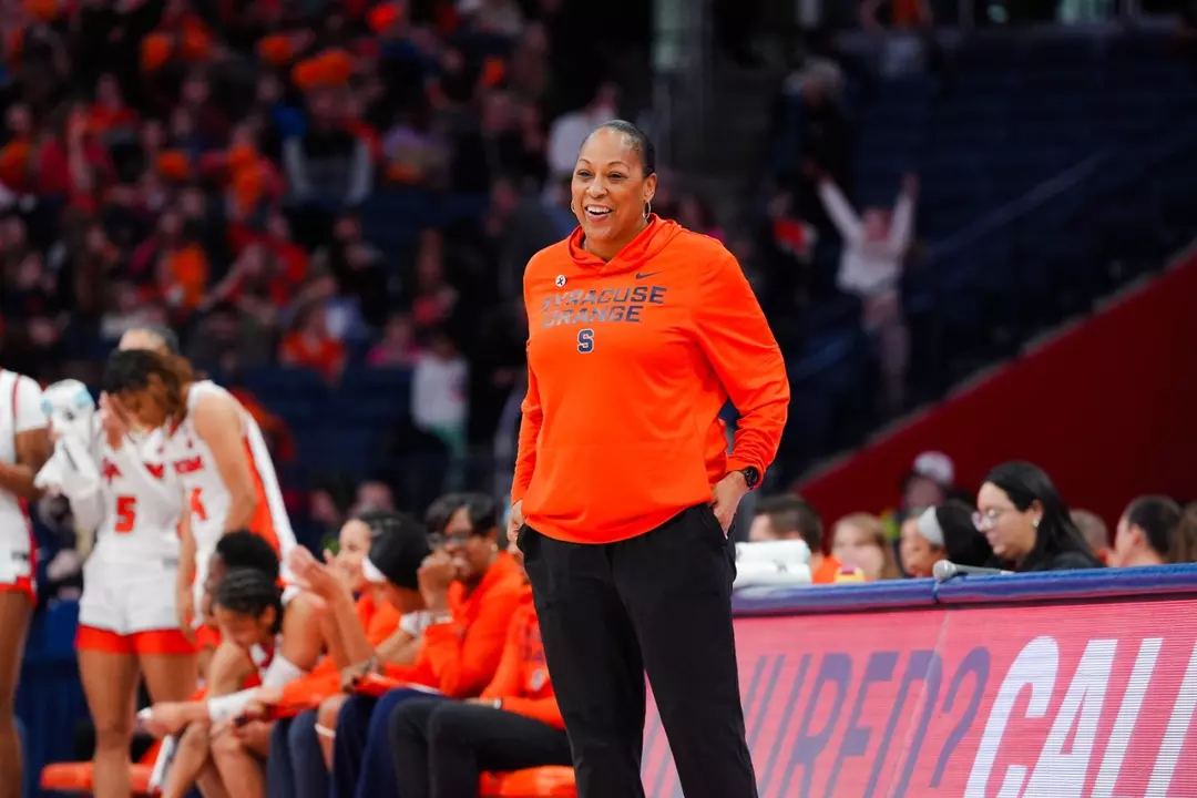 Felisha Legette-Jack smiling on the sidelines