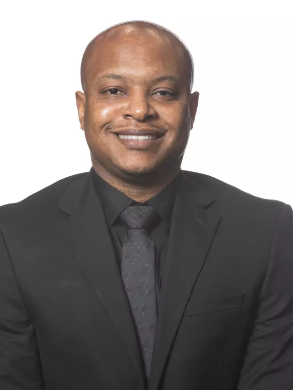 COLLEGE STATION, TX - October 26, 2023 - Associate Coach Devin Johnson of the Texas A&M Aggies headshot during Texas A&M Men?s Basketball CEO photo day  in College Station, TX. Photo By Craig Bisacre/Texas A&M Athletics