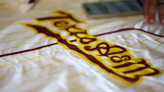 COLLEGE STATION, TX - April 12, 2024 - Turn it gold jersey during the game between the Vanderbilt Commodores and the Texas A&M Aggies at Blue Bell Park in College Station, TX. Photo By Rachel Mahan/Texas A&M Athletics