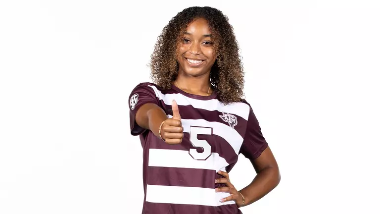 Tessa Lavender flashes the Gig 'em in her 2025 media day portrait shoot