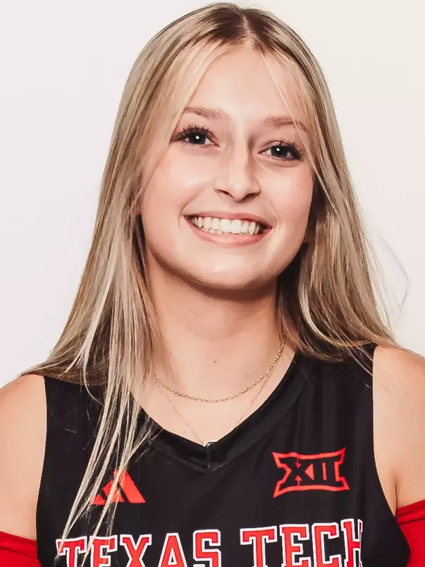 Ava Johnson in a black uniform posing for a headshot.
