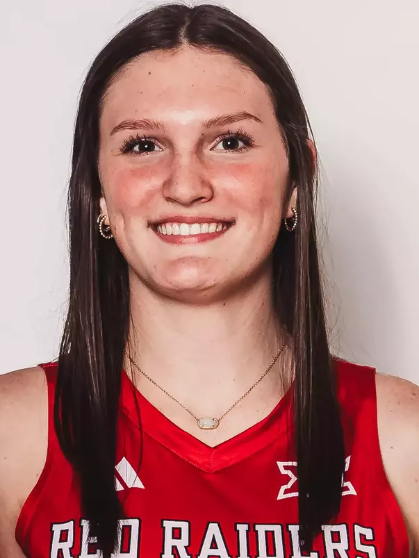 Elia Dinsmore in a red uniform posing for a headshot.