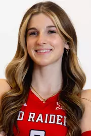 Gretchen Sigman in a red uniform posing for a headshot.
