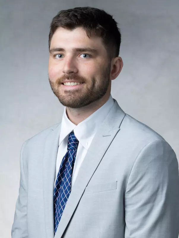 Studio portrait of Riley Miller, Assistant Coach, taken in the OEC Photo Studio on July 07, 2026 in St. Paul.