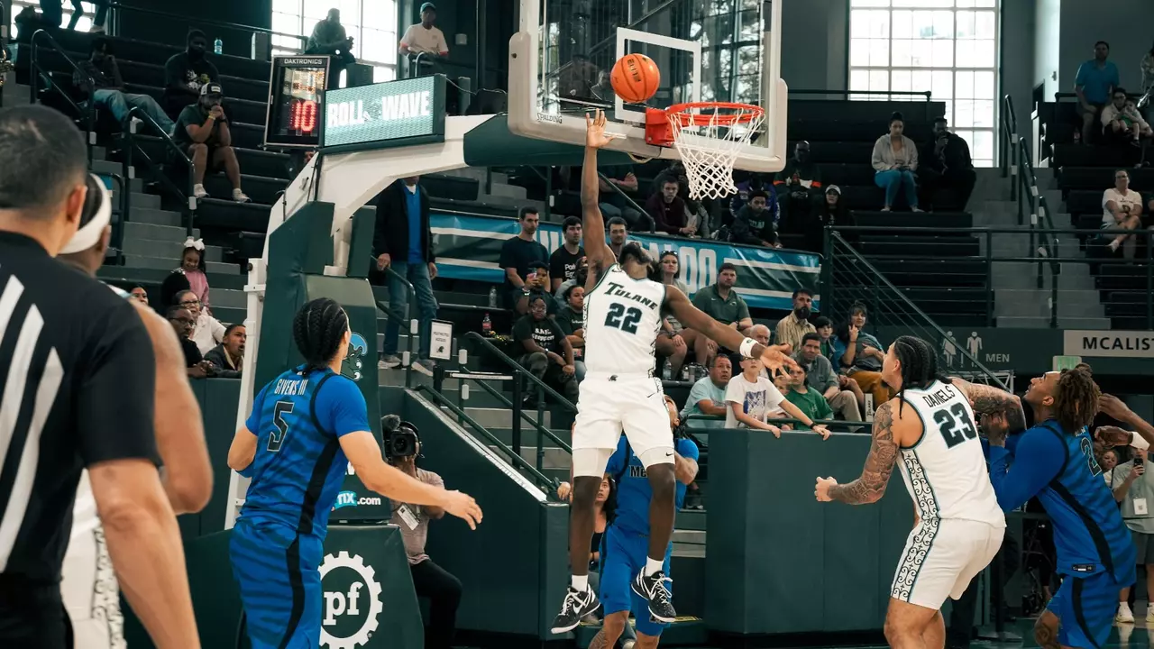 Asher Woods shoots reverse layup against Memphis on March 8.