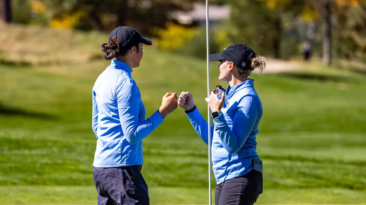 Francesca Pompa fist bumps head coach Andrea Kaelin.