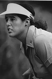 Nancy Lopez looking at her shot on the golf course