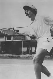 Layn Phillips swinging a tennis racket