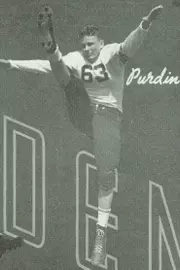 Purdin kicking the football