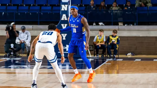 Tylen Riley scans the defense against Rhode Island in the Veterans Classic