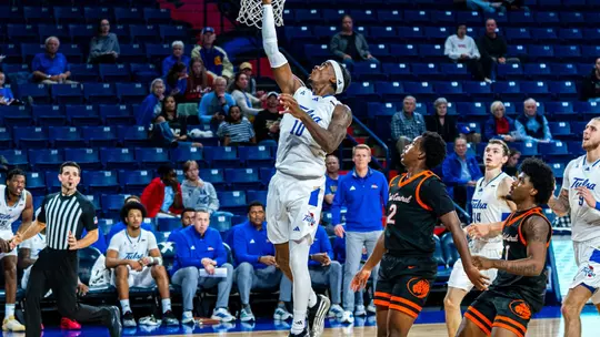 Tylen Riley attempts a layup against East Central