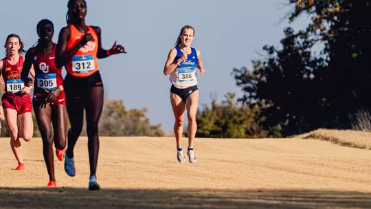 Evyn Humphrey runs down the home stretch at the Midwest Regional