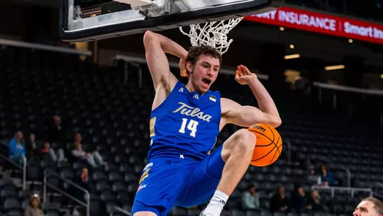Miles Barnstable celebrates a dunk against San Jose State