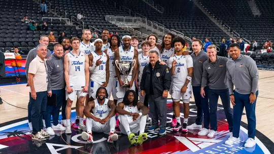 Men's Basketball celebrates winning the Acrisure Holiday Invitational
