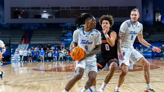 Myles Rigsby in the post against Denver