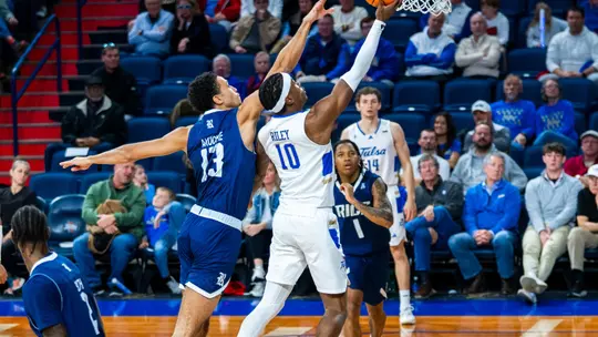 Tylen Riley goes for a layup against Rice