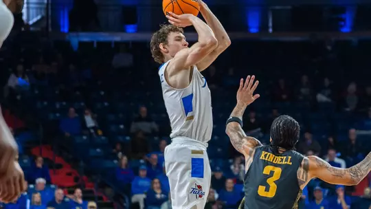 Miles Barnstable shoots a three against Wichita State