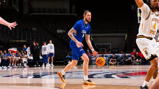 Tyler Behrend dribbles the ball against Wichita State in the American Conference semifinals