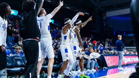 The Tulsa bench celebrates against UTSA