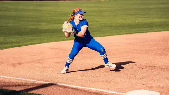 Maci Cole fields a ball at third against Oklahoma State