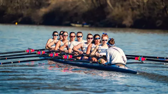 Rowers on the verdigris river