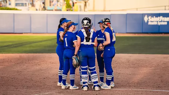 Tulsa huddles in the circle against Oklahoma State