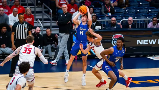 Miles Barnstable shoots a three against New Mexico in the NIT Semifinals