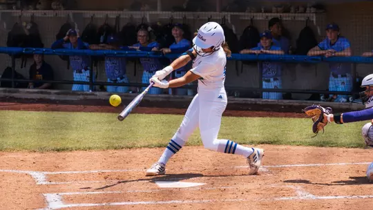 Faith Russell connects on a home run against East Carolina